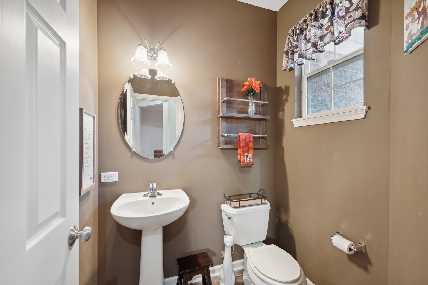 1355 Draper Road McHenry, IL 60050 - Photo 9 of 18 a bathroom with a toilet sink and mirror