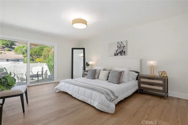 a bedroom with a bed and a couch