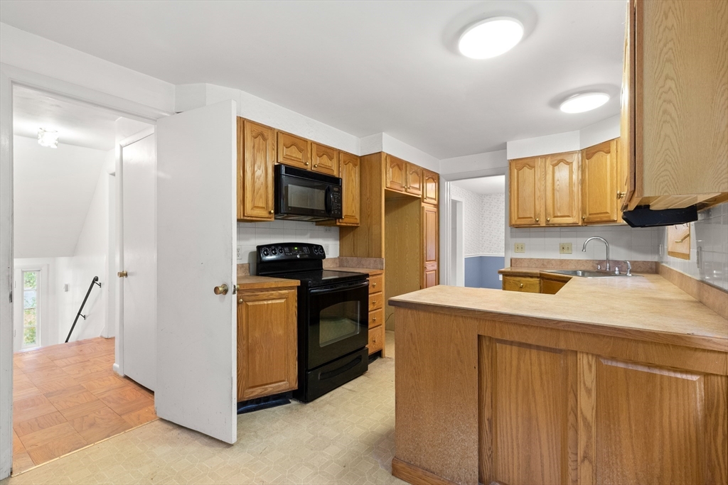 4 Pine Ridge Road Topsfield, MA 01983 - Photo 13 of 40 a kitchen that has a sink and a stove in it