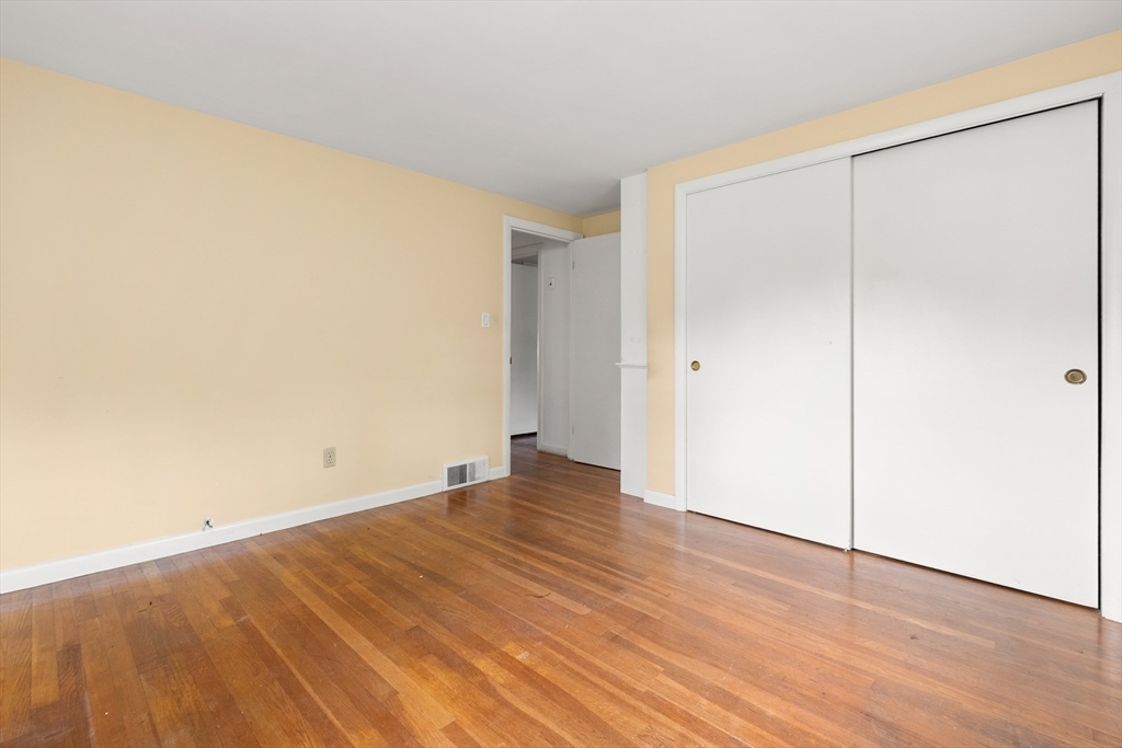 4 Pine Ridge Road Topsfield, MA 01983 - Photo 21 of 40 a view of an empty room with wooden floor
