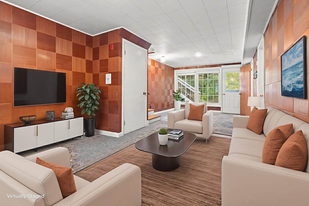 4 Pine Ridge Road Topsfield, MA 01983 - Photo 26 of 40 a living room with furniture and a flat screen tv