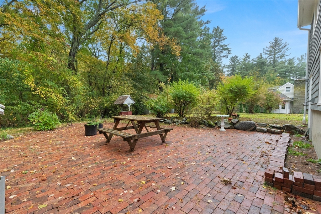 4 Pine Ridge Road Topsfield, MA 01983 - Photo 33 of 40 a bench sitting in the middle of a backyard