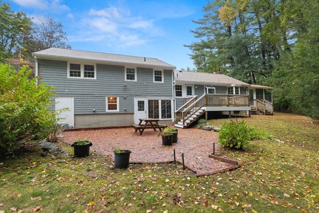 4 Pine Ridge Road Topsfield, MA 01983 - Photo 34 of 40 a front view of a house with a yard