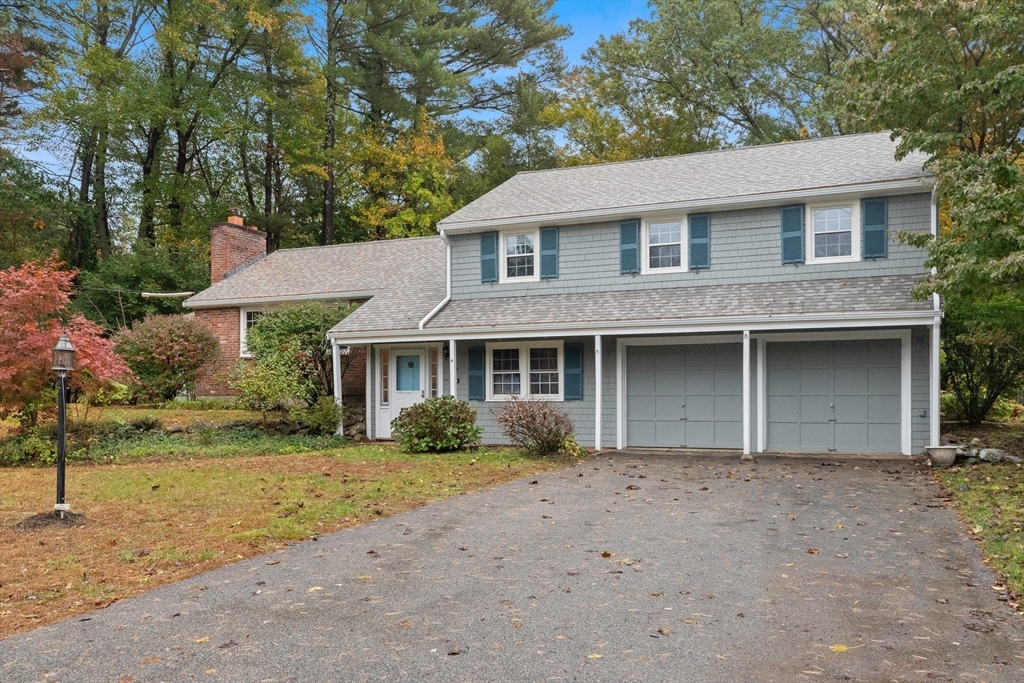 4 Pine Ridge Road Topsfield, MA 01983 - Photo 36 of 40 a front view of a house with a garden