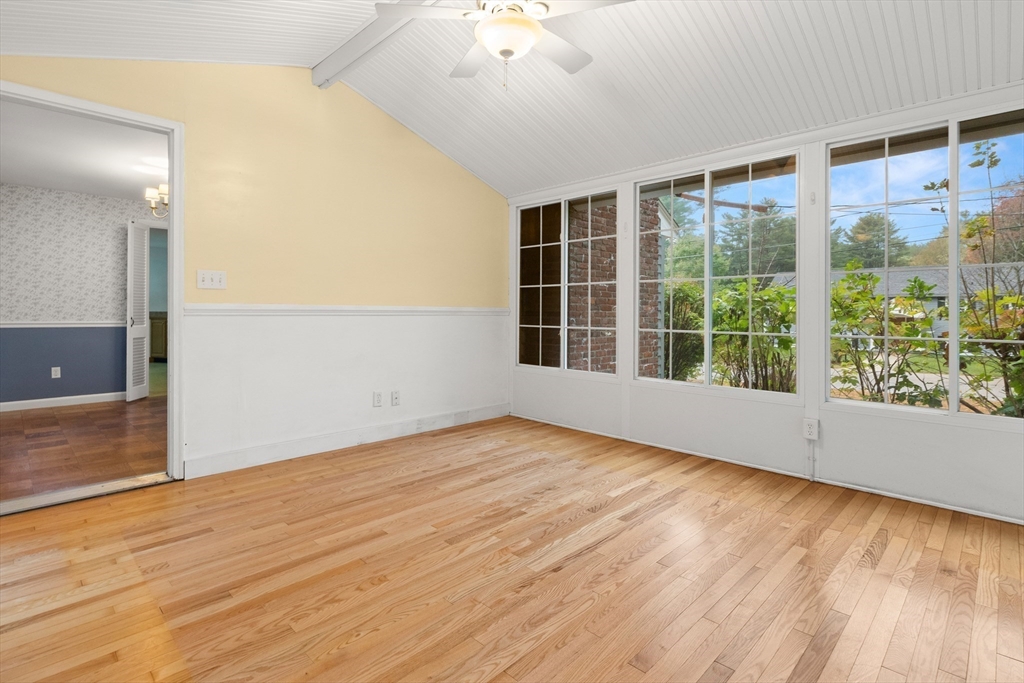 4 Pine Ridge Road Topsfield, MA 01983 - Photo 10 of 40 a view of an empty room with wooden floor and a window