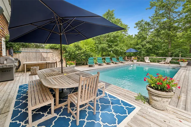 a view of a patio with furniture and yard