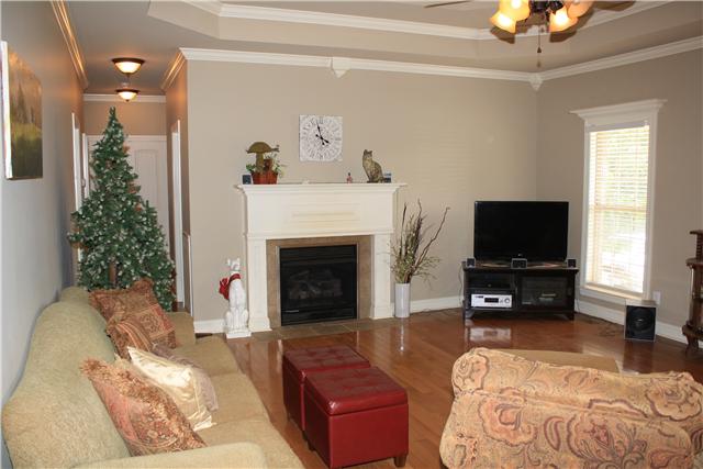 34460 Ardmore Ridge Road Prospect, TN 38477 - Photo 8 of 20 Family Room - More of the wood flooring plus trey ceiling, gas log fireplace and extensive crown and corner moldings.