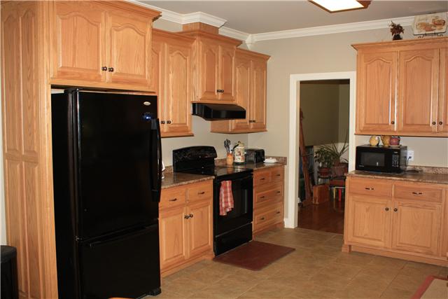 34460 Ardmore Ridge Road Prospect, TN 38477 - Photo 10 of 20 Kitchen - Crown molding and tile flooring. Stove, dishwasher and refrigerator remain.
