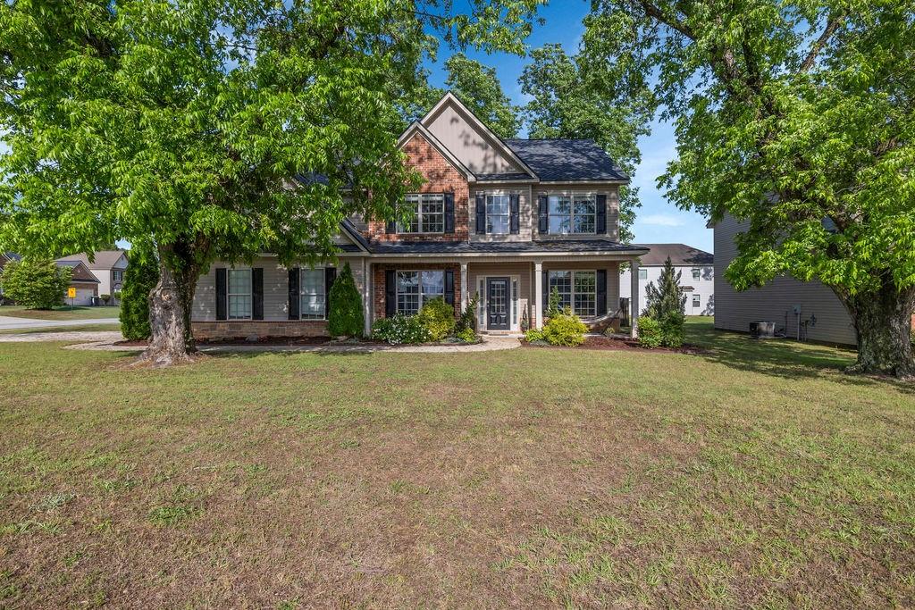 126 Meadow's Walk Drive Byron, GA 31008 - Photo 1 of 37 a front view of a house with a garden