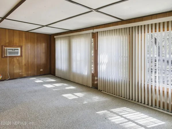 a view of empty room with windows