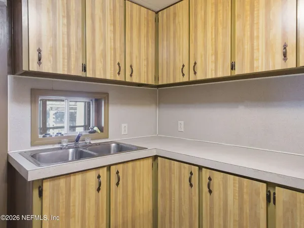 a kitchen with stainless steel appliances a refrigerator and a stove