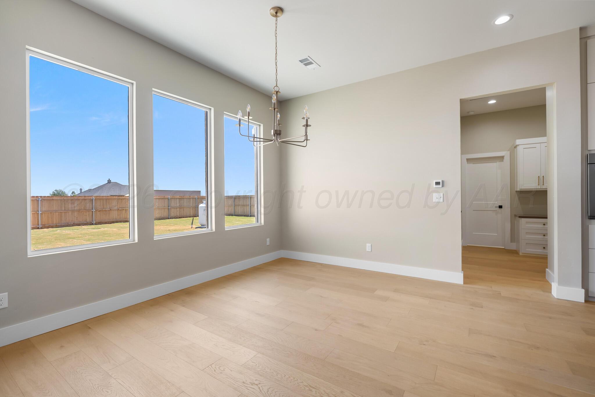 4201 Juniper Springs Road Amarillo, TX 79119 - Photo 5 of 27 a view of an empty room with a window