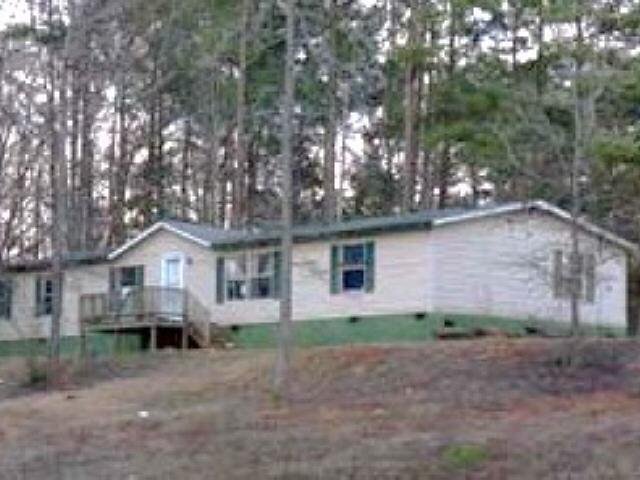 178 Rebon Maddox Road Jackson, GA 30233 - Photo 1 of 1 a house that has a tree in front of it