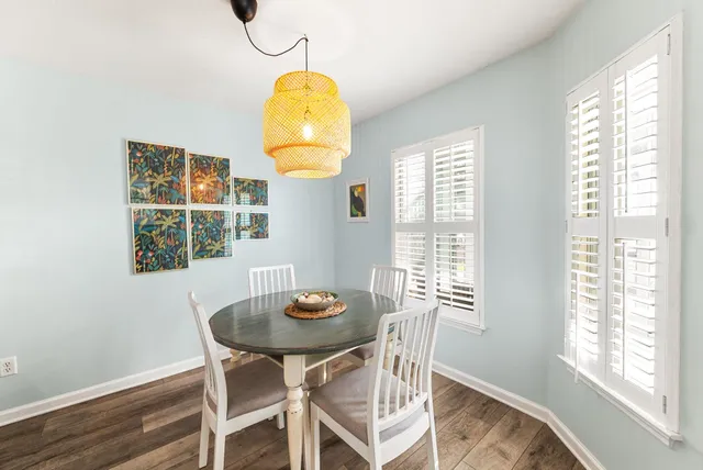 a view of a dining room with furniture and window