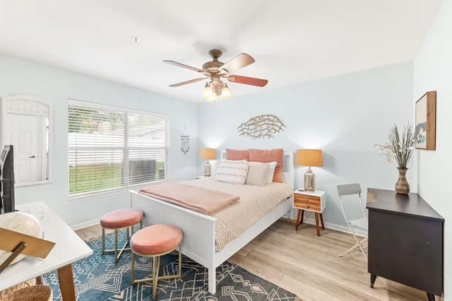 a bedroom with a bed and a table