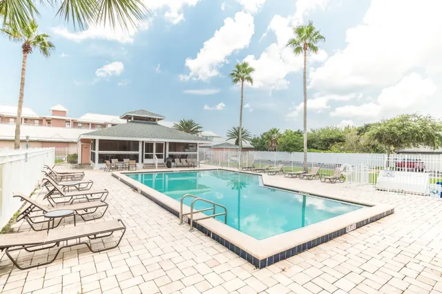 a view of a house with a yard and plants