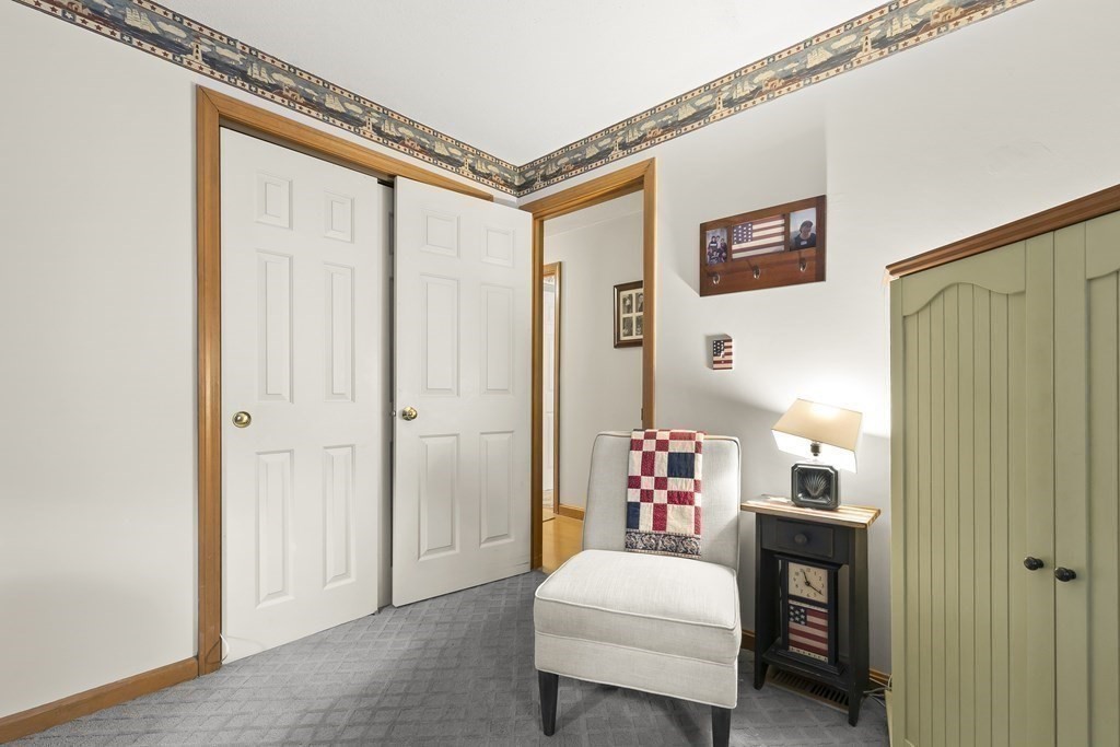 41 Sconset Circle Sandwich, MA 02563 - Photo 19 of 38 a bedroom with a bed and a table in it