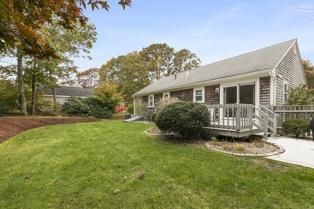 41 Sconset Circle Sandwich, MA 02563 - Photo 26 of 38 a view of a house with backyard and sitting area