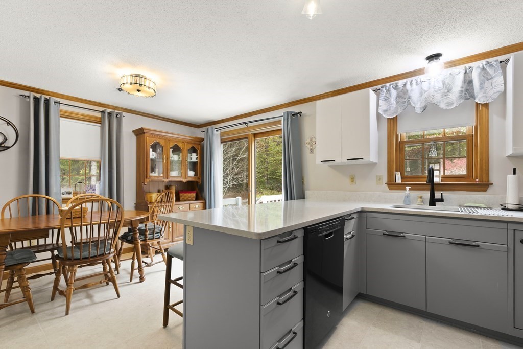 41 Sconset Circle Sandwich, MA 02563 - Photo 9 of 38 a open kitchen with stainless steel appliances granite countertop a sink and cabinets