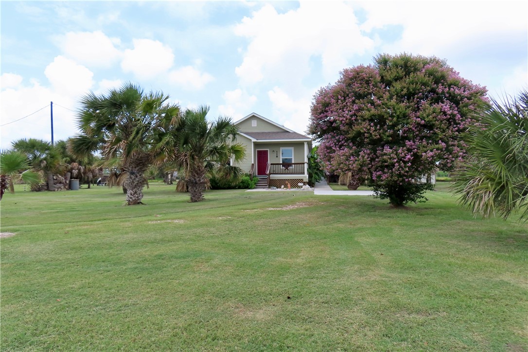 118 Salt Lake Road Rockport, TX 78382 - Photo 13 of 34 a front view of a house with garden