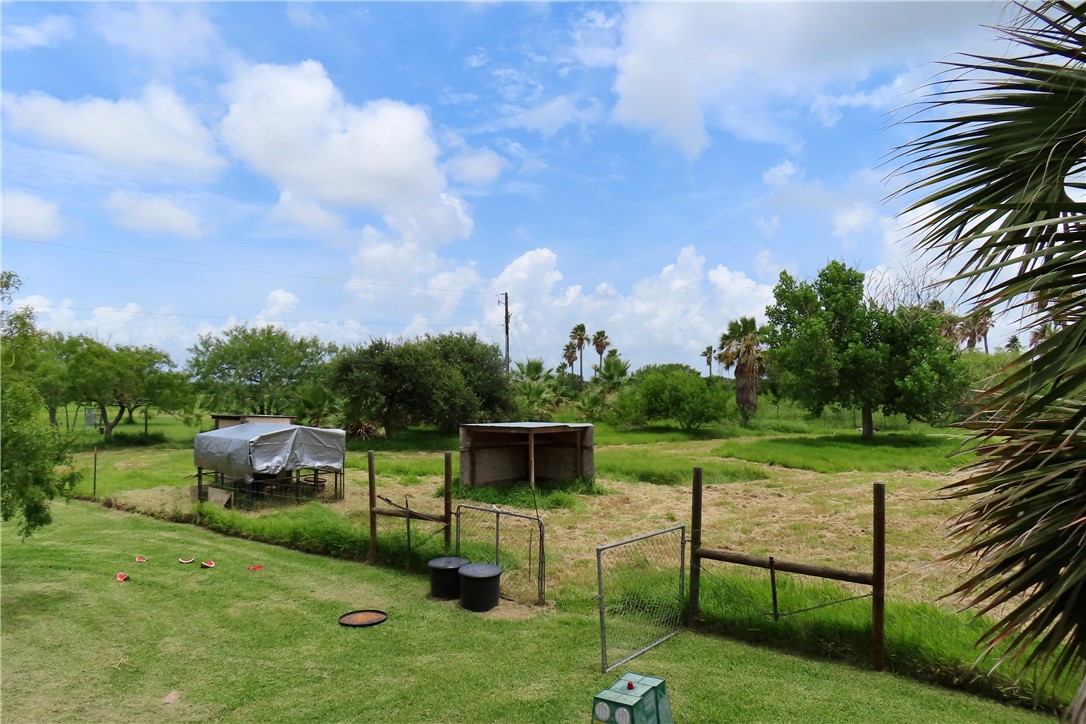 118 Salt Lake Road Rockport, TX 78382 - Photo 19 of 34 a view of a garden with a bench in the garden