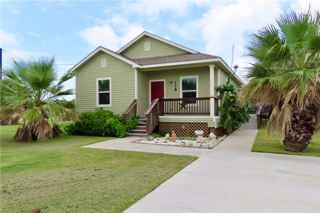 118 Salt Lake Road Rockport, TX 78382 - Photo 2 of 34 a front view of house with yard and green space