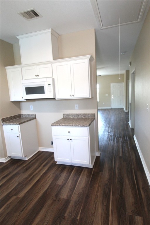 118 Salt Lake Road Rockport, TX 78382 - Photo 22 of 34 a hallway view with wooden floor and cabinets
