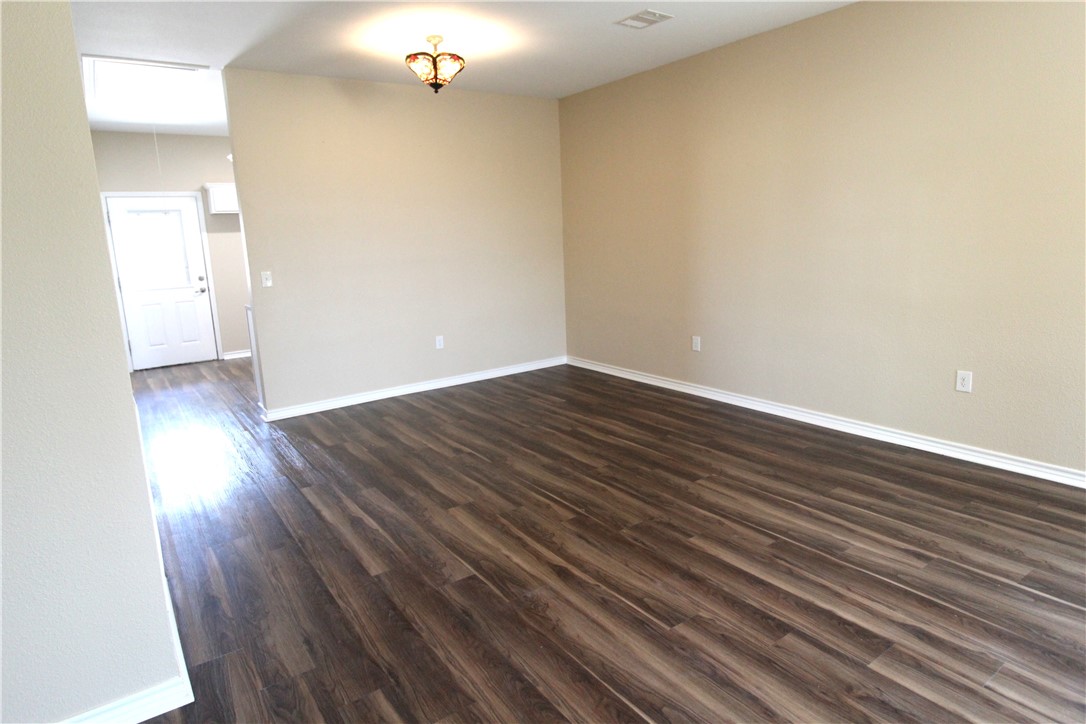 118 Salt Lake Road Rockport, TX 78382 - Photo 30 of 34 a view of an empty room with wooden floor