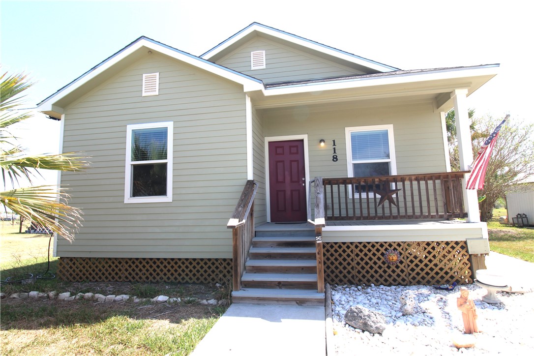 118 Salt Lake Road Rockport, TX 78382 - Photo 3 of 34 a view of a house with wooden deck
