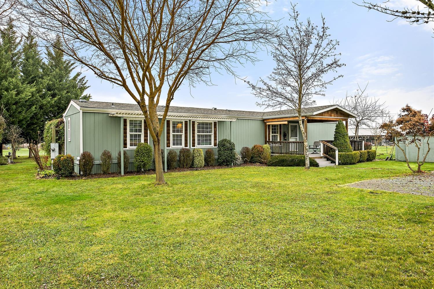4930 Leonard Road Grants Pass, OR 97527 - Photo 3 of 33 a front view of house with yard outdoor seating and green space