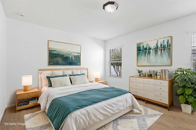 an empty room with a empty space and windows