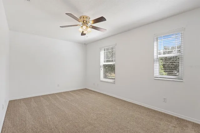 a bathroom with a toilet sink a mirror a bathtub and shower