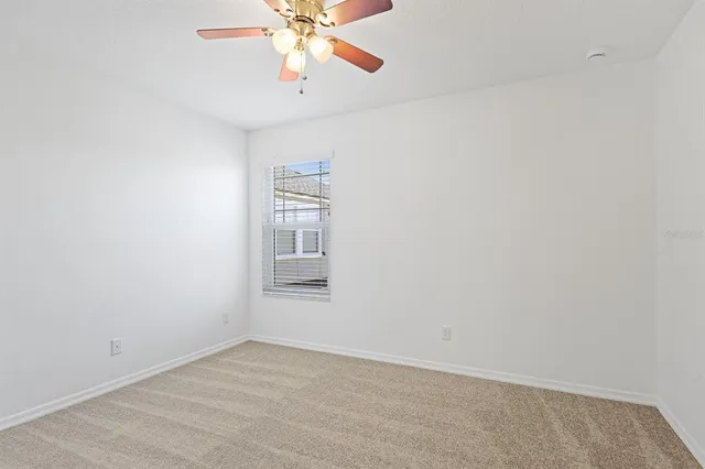a bathroom with a sink vanity mirror and toilet
