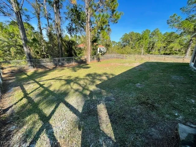 a view of yard with an outdoor space