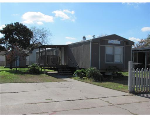 6021 Skyline Drive Corpus Christi, TX 78408 - Photo 1 of 9 a front view of a house with garden