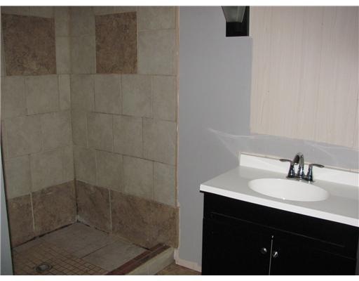 6021 Skyline Drive Corpus Christi, TX 78408 - Photo 5 of 9 a bathroom with a sink shower and a mirror