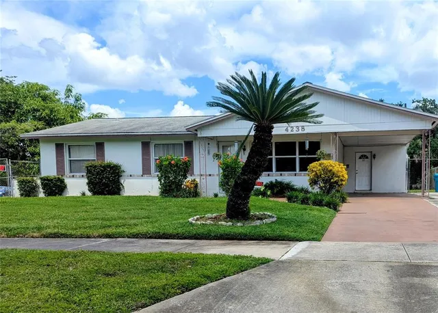 a front view of a house with garden and porch