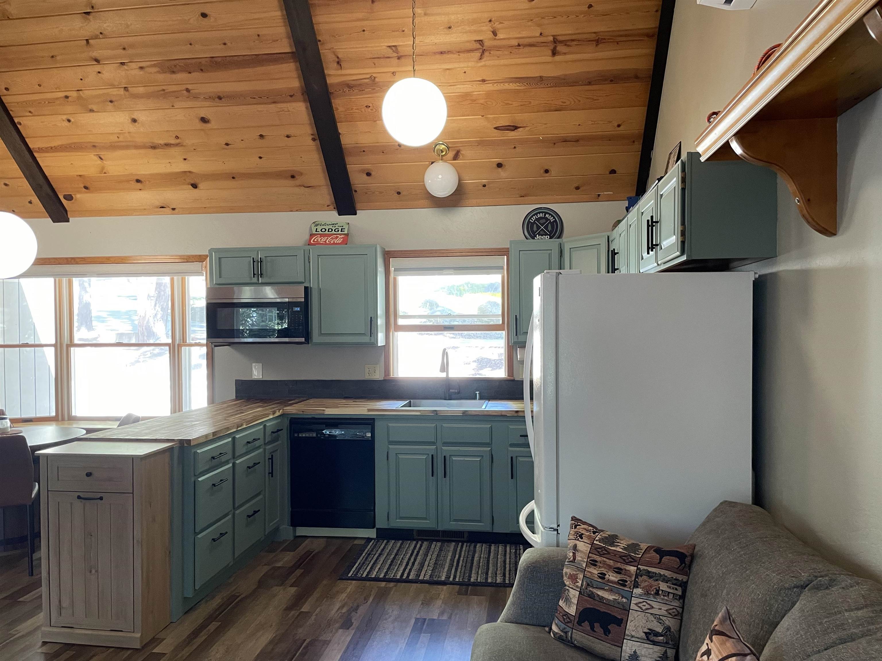 603 East Burnt Cedar Road Lake Almanor, CA 96137 - Photo 11 of 33 a kitchen with cabinets and window