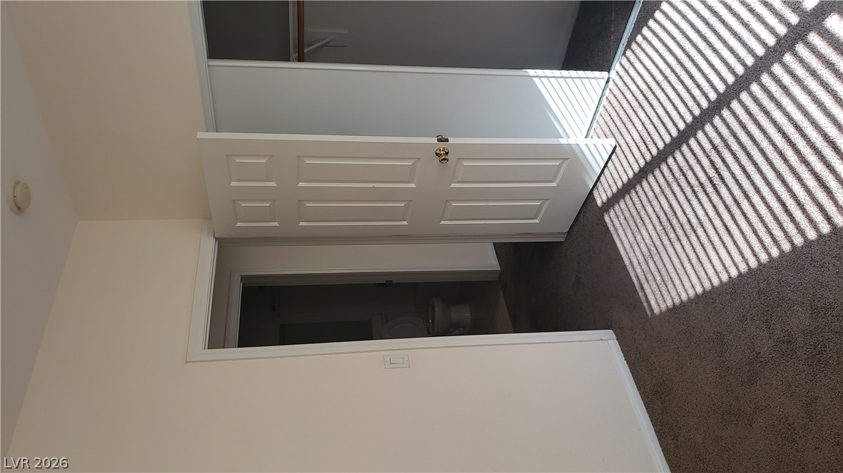 9112 Manalang Road Las Vegas, NV 89123 - Photo 44 of 50 Sun-drenched carpeted bedroom with a convenient in-room closet and access to a private bathroom.