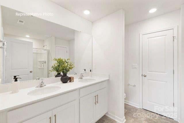 1324 Equestrian Lane York, SC 29745 - Photo 10 of 15 a bathroom with double sink and a mirror