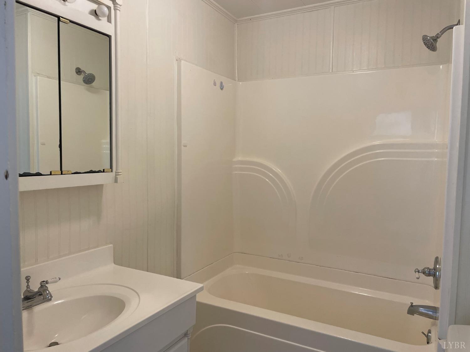 606 Jeter Street Bedford, VA 24523 - Photo 12 of 15 a bathroom with a sink and a bathtub