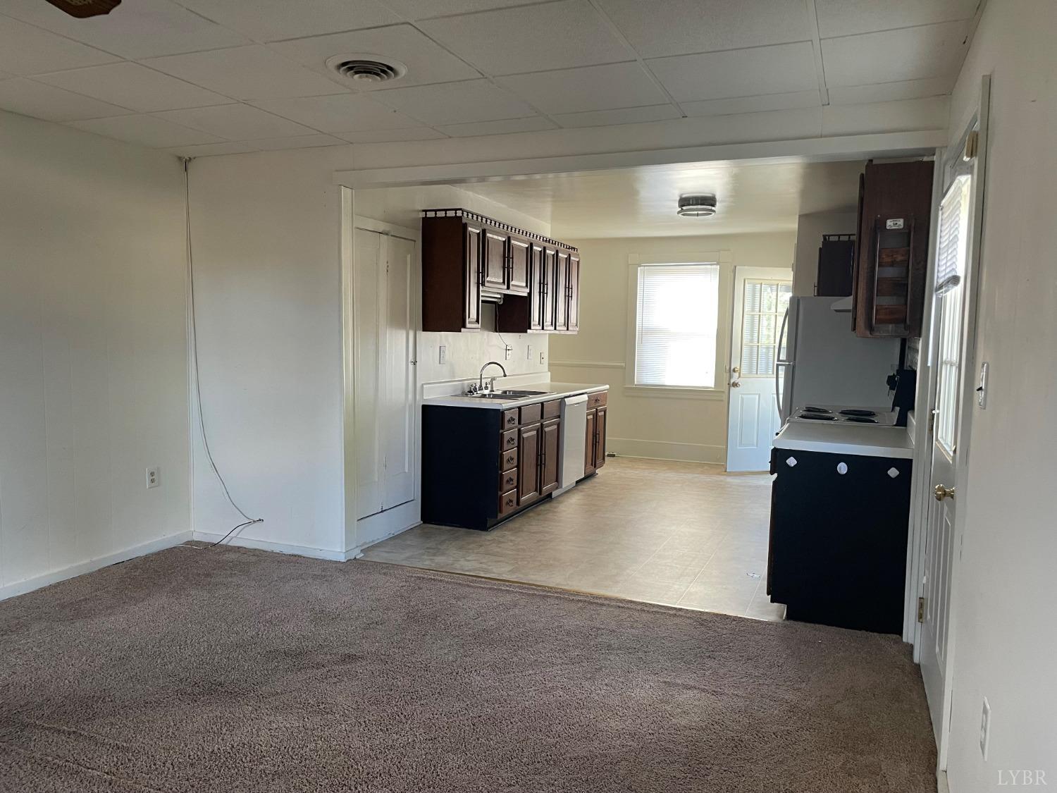 606 Jeter Street Bedford, VA 24523 - Photo 5 of 15 a living room with stainless steel appliances kitchen island granite countertop a refrigerator and a stove top oven
