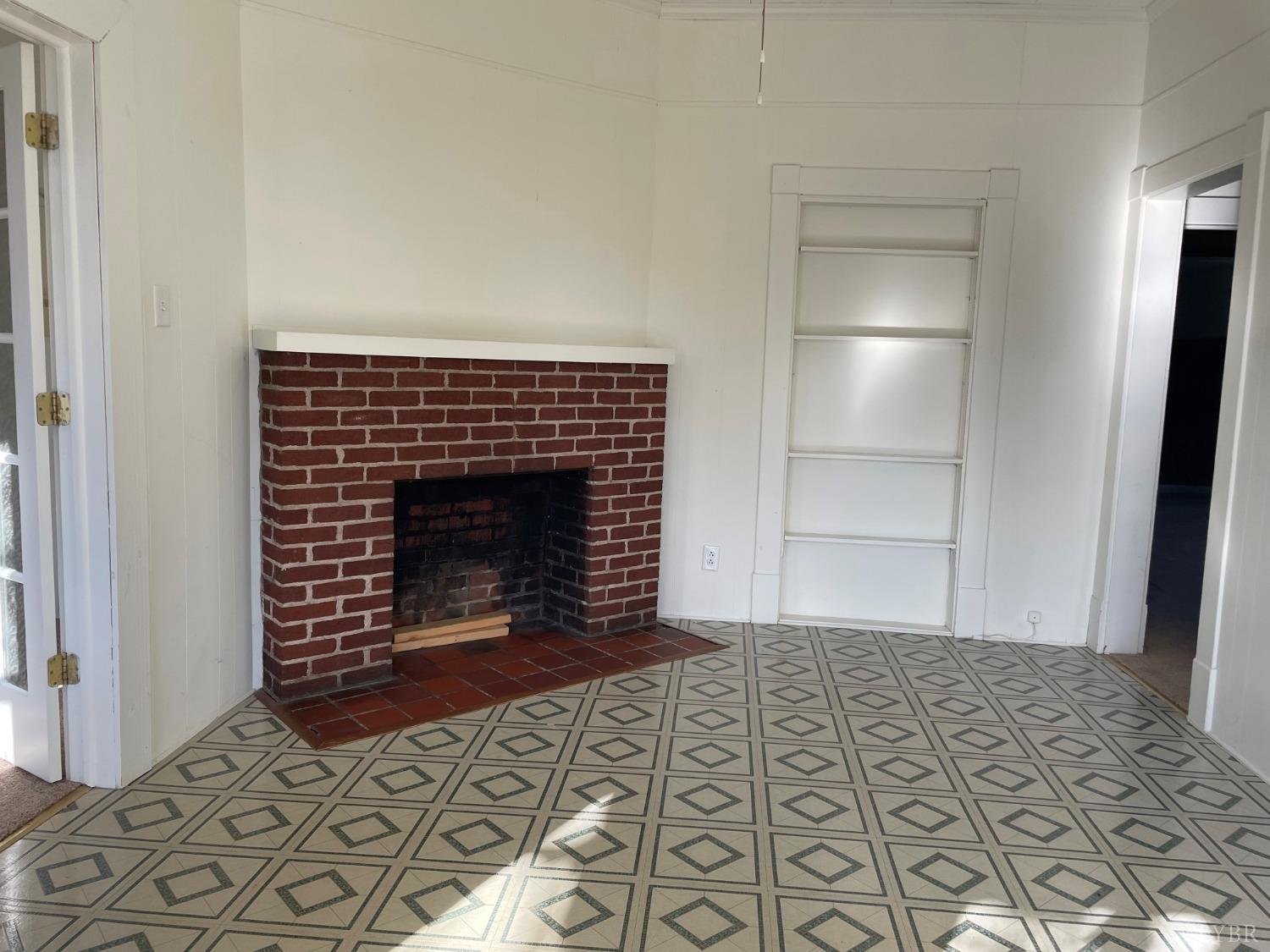606 Jeter Street Bedford, VA 24523 - Photo 9 of 15 a living room with a fireplace and a rug