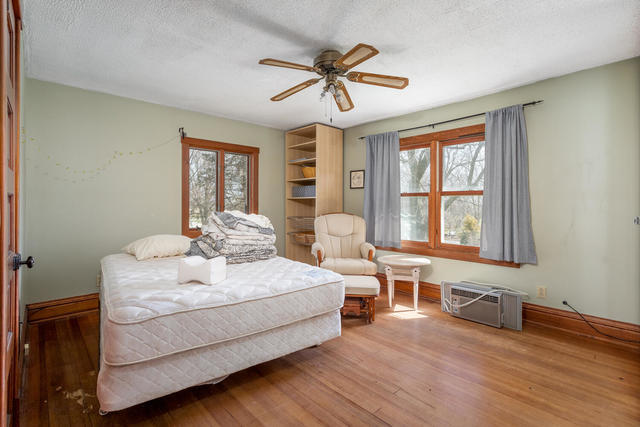 1111 Simons Road Oswego, IL 60543 - Photo 14 of 37 a spacious bedroom with a bed and window