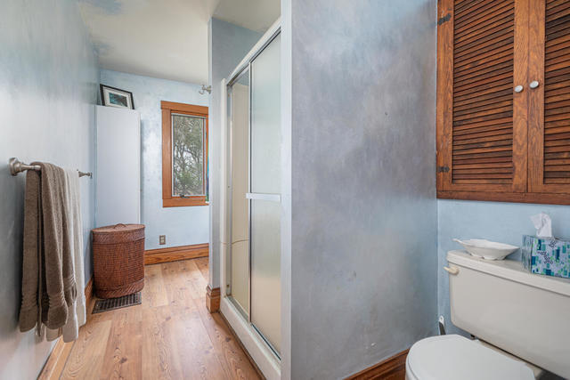 1111 Simons Road Oswego, IL 60543 - Photo 18 of 37 a bathroom with a toilet a sink and a mirror