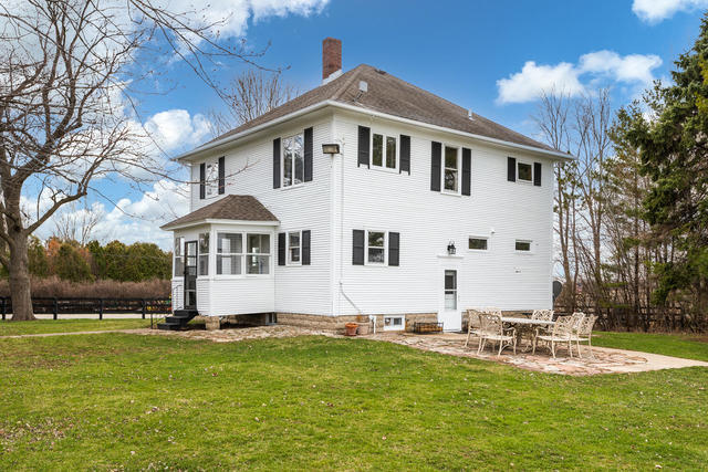 1111 Simons Road Oswego, IL 60543 - Photo 19 of 37 a front view of a house with swimming pool yard and patio