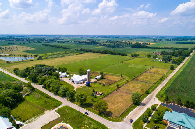 1111 Simons Road Oswego, IL 60543 - Photo 36 of 37 an aerial view of a house with a garden and lake view