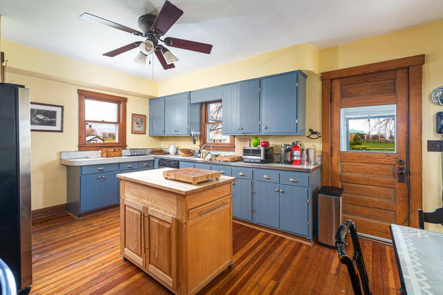1111 Simons Road Oswego, IL 60543 - Photo 9 of 37 a kitchen with granite countertop a sink appliances cabinets and a counter top space