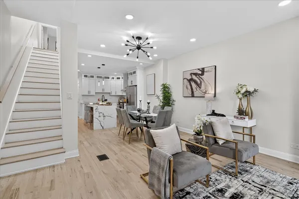 a view of a dining room with furniture and wooden floor