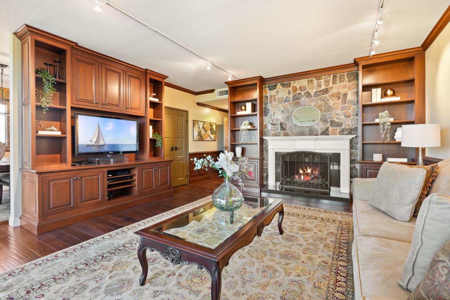 50 Mounds Road, Unit 205 San Mateo, CA 94402 - Photo 1 of 28 a living room with furniture a flat screen tv and a fireplace